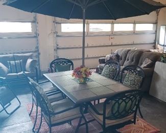 Outdoor patio furniture (table, 8 chairs, umbrella, glider, outdoor rug)
