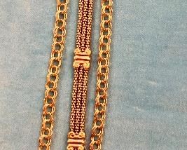 Item 229: 14K gold "Reena" Bracelet: $325 Item 230: Three Row, 7.5" long 14K gold bracelet: $745 Item 231: (1) 14K Charm Bracelets: SOLD