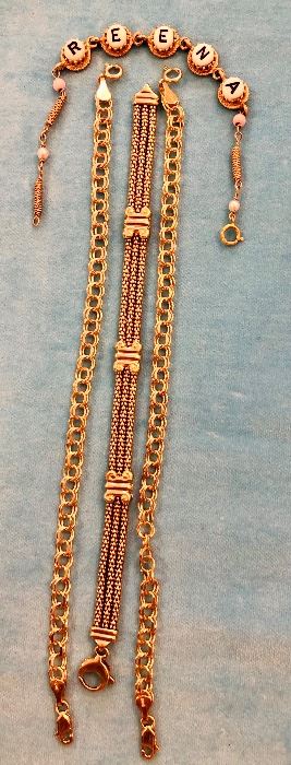 Item 229:  14K gold "Reena" Bracelet: $325                                                 Item 230:  Three Row, 7.5" long 14K gold bracelet: $745                                                                                                             Item 231:  (1) 14K Charm Bracelets: SOLD