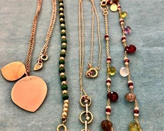 Item 246:  14K gold and semi-precious stones: SOLD                          Item 247:  14K gold necklace with three circles with small diamonds(middle):  $165                                                                      Item 248:  Green and gold beaded $38                                                             Item 249:  On left - gold and silver pendant: $125                                                         Item 250:  Tested 14K gold dangle circle earrings (top middle): $65                             