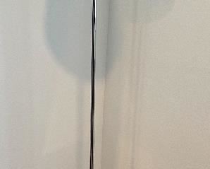 Item 32: Jupe Classic Floor Lamp by Artemide. Shade in molded, ribbed, sanded glass. Base and socket cover in polished aluminum. Designed by Peclar Nalbandian & Guy Burr.- 59": $525