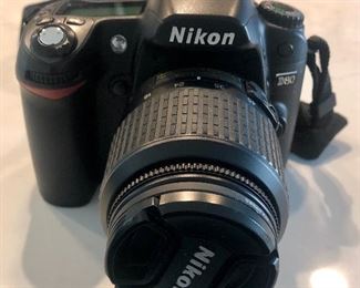 Item 144:  Nikon D80 SLR  in excellent condition. 
Camera body plus the attached lens (NIKKOR 18-55mm): $165
