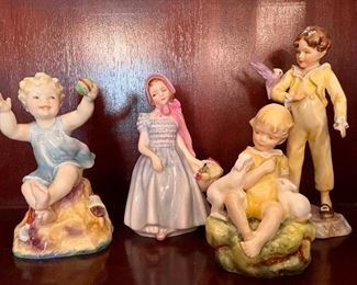 Item 104:  Royal Doulton "The Dandelion" - 4":  $55 (SOLD).                                                                                                   Item 105:  Royal Doulton "Wendy" - 4": $22                                                                      Item 106:  Royal Worcester "The Parakeet" - 6.25": $22                                                                                                       
Item 107:  Porcelain Baby with Ball:  $24 (SOLD)                                                    