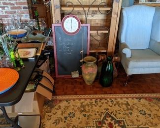Wingback chair, glassware, pottery (please note large wood cabinet in this picture is not for sale)