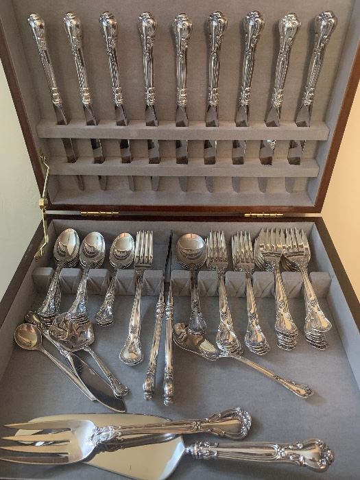 8 complete place settings of Chantilly silver with extra pieces.