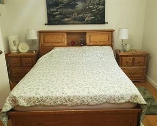 Queen bed with with storage drawers underneath and storage with headboard 