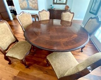 26-	Round table with single pedestal & detachable leave 56”R w/o leaves, 74”R with		$795