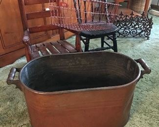 Copper Kettle with handles...no lid.  Love the child rocker and bentwood chair plus wire basket.