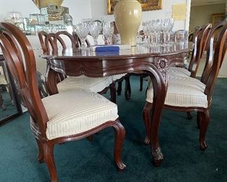 Beautiful cherry dining table. 10 chairs and three leaves