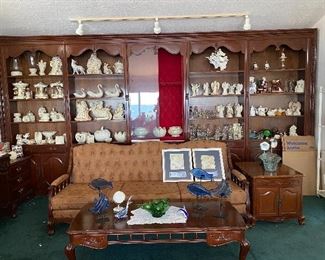 Couch, coffee table and end tables from Thailand 
Gun display case in the middle & 4 bookcases
