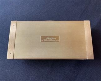 Men’s 1960’s Longines 5-Star Admiral wrist watch with a 14kt gold bezel.  Comes with original Longines watch strap, gold colored case, pamphlet and box.  In working condition!