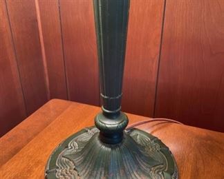 Antique slag glass table lamp. There is one broken panel as photographed