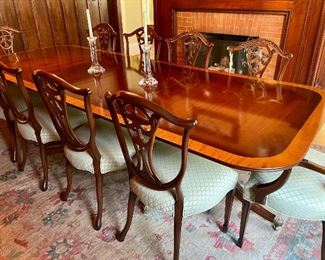Traditional style dining table -solid mahogany with satinwood banding, double pedestals with flared legs, brass toe caps and casters.  
Pink & Green Rug 13'6" x 9' 11"