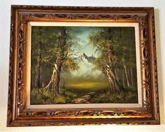Beautifully framed trees and a majestic mountain artwork.