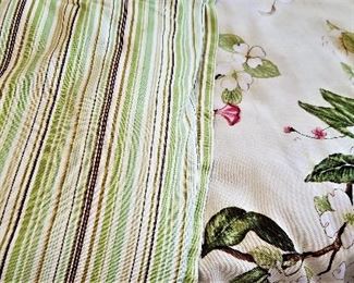 The springtime floral queen comforter is reversible to a striped pattern.
