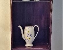 Tall and narrow display cabinet with lighting. Great for fitting in a small area.