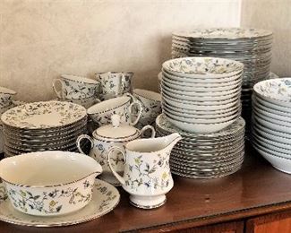 Another view of the gray and white dinnerware set of dishes with accessory pieces.