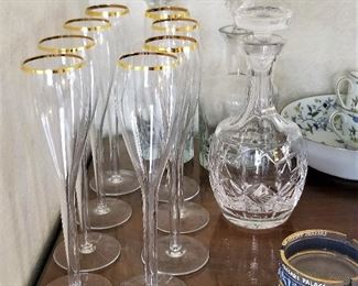 Gold rimmed modern champagne glasses.