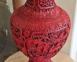 Relief carved red vase