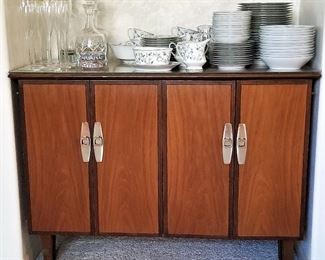 Mid-century modern buffet/server. Has storage with shelves inside.