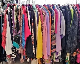 Lots of designer clothes in different sizes.