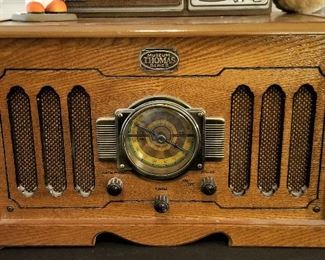 Nostalgic Thomas radio and vinyl record player. Top opens to reveal the record player. 