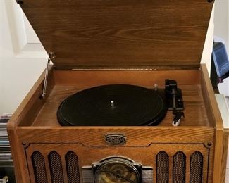 Nostalgic Thomas radio and vinyl record player. Top opens to reveal the record player. 