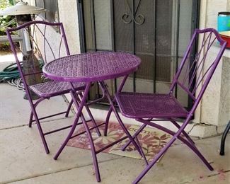 Unusual purple bistro table and chairs set.