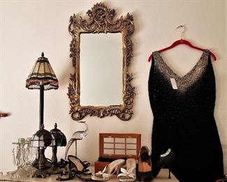 Vintage display of fabulous mirror, a vintage black dress, stained glass lamps, shoes, jewelry box, etc...