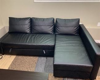 IKEA Freiheten 3 seater Sleeper couch with storage compartment, black leather. $699 new from store, asking $500. Buyer must disassemble and transport.