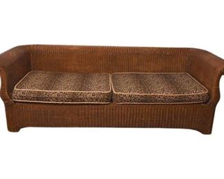 38. Wicker Sofa With Faux Leopard Cushions