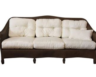 88. Contemporary Wicker Style Sofa With White Cushions