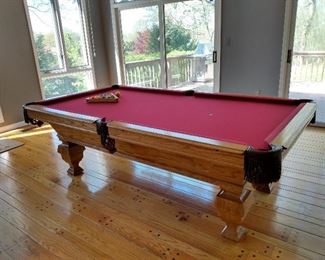 Pool table, sticks, and balls