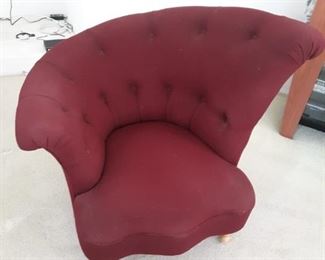 Burgundy lounge chair with flared tufted back