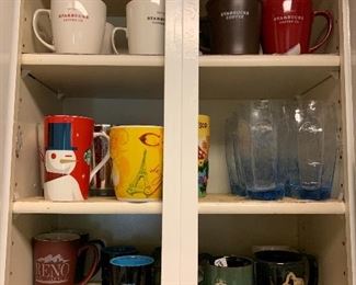 Great Mugs $1 to $4 each                                                          Blue Glasses $6/6 SOLD 
Starbucks mugs on top shelf - Sold