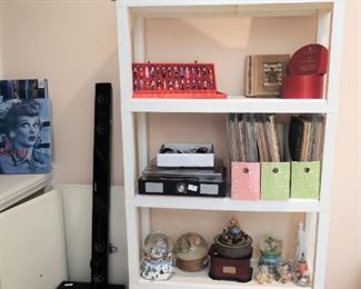 Boxes of old Sheet Music, holiday snow globs, Subwoofer and Sound bar, holiday decor and Oriental Decor