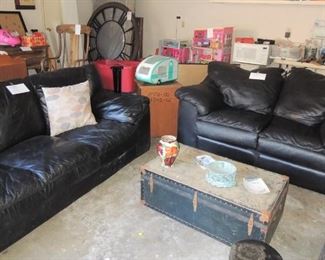 Leather couch and loveseat.  Old steamer trunk