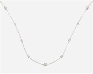1011
A Diamond Spectacle Link Chain Necklace
18k white gold
Set with fifty-two full-cut round diamonds totaling 6.71ct and graded G-J color and Si to I clarity
58" C
13 grams
Estimate: $2,000 - $3,000