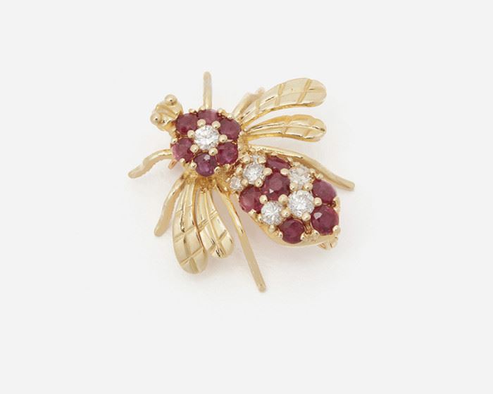 2001
A Ruby And Diamond Bee Brooch
14k yellow gold
Set with seven full-cut round diamonds totaling approximately 0.40ct and graded H-I color, SI clarity, and further set with twelve round rubies totaling approximately 0.80ct
.875"W x .875"H
3 grams
Estimate: $600 - $800