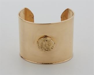 2007
A Gold Coin Style Cuff
14k yellow gold
Designed as a wide rigid cuff topped with a coin style element
7" L x 2" H
89 grams
Estimate: $3,000 - $5,000