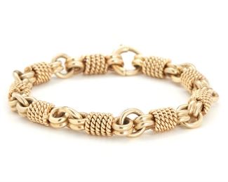 2024
A Gold Link Bracelet
14k yellow gold
Of rope-work design
8" L x .325" W
46.5 grams
Estimate: $1,200 - $1,800