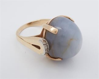 2027
A Retro Star Sapphire And Diamond Ring
Circa 1945, 18k yellow gold
Centering a star bluish-grey sapphire gauged at approximately 34.00ct, flanked by small single-cut round diamonds
Ring size: 7.5
19 grams
Estimate: $1,000 - $1,500
