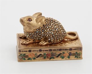2070
A Gem-Set Mouse Stamp Box
Vermeil; Stamped: Germany / 84
Topped with a three dimensional mouse set with seed pearls and ruby eyes a floor of chased design, the box surrounded with colorful enamel flowers
2.25" L x 1.25" W x 1.5" H
88.5 grams
2 pieces
Estimate: $500 - $700