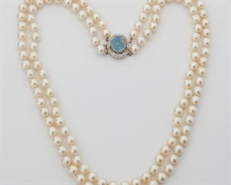 2074
A Cultured Pearl, Opal Doublet And Diamond Necklace
14k white gold
A double strand cultured pearl (7.7mm) necklace with an oval opal doublet clasp set with twenty single-cut round diamonds totaling approximately 0.40ct and graded H-I color and SI clarity
21" L
99 grams
Estimate: $600 - $800