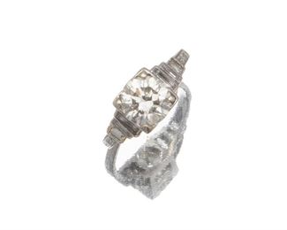 2077
An Art Deco Diamond Ring
Circa 1930, platinum
Centering an old mine-cut diamond gauged at approximately 1.10ct and graded J-K color, SI2 clarity, further set with six baguette-cut diamonds
Ring size: 4
2.5 grams
Estimate: $1,500 - $2,000