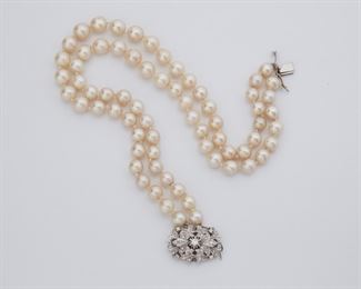 2079
A Double Strand Cultured Pearl And Diamond Choker Necklace
18k white gold
With cultured pearls measuring from 8.5mm-9.5mm and a gold clasp set with small single and full-cut diamonds totaling approximately 0.20ct
14" L
80 grams
Estimate: $500 - $700