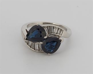 2082
A Sapphire And Diamond Crossover Ring
Platinum
Set with two pear-shaped sapphires totaling approximately 4.20ct, further set with two baguette-cut diamonds totaling 0.80ct and graded G-H color and VS clarity
Ring size: 7.5
7.9 grams
Estimate: $1,500 - $2,000