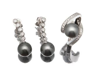 2086
A Group Of Tahitian Cultured Pearl And Diamond Jewelry Items
14k white gold
Comprising a pair of earrings with Tahitian cultured pearls measuring 9mm-9.5mm (1" H) and a ring (7.5) centering a Tahitian cultured pearl measuring 9mm-10mm, further set with full-cut round diamonds totaling 0.70ct and graded H-I color, VS-SI clarity
12 grams
3 pieces
Estimate: $500 - $700