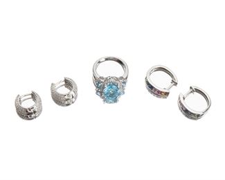 2110
A Group Of Gem-Set Jewelry Items
14k white gold
Comprising a blue topaz and diamond ring set with full-cut round diamonds totaling approximately 0.25ct (size: 7), a pair of multi-colored sapphire hoops (.75" H x .25" W), and a pair of pave-set diamond hoops (.5" H x .375" W)
17.5 grams
5 pieces
Estimate: $400 - $600