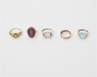 2128
Five Gold Rings
14k yellow gold
Comprising a gold band; and four rings set with various gemstones including topaz, citrine, ruby, diamond, and amethyst
Largest ring size: 7
22.4 grams
5 pieces
Estimate: $500 - $700